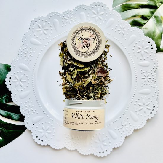 Experience the delicate essence of White Peony Tea, also known as Pai Mu Tan, a tranquil blend crafted from tea buds collected and withered prior to opening. With its low caffeine content and potential health benefits, it's perfect for moments of relaxation.